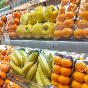Fruits in a shop wrapped in plastic